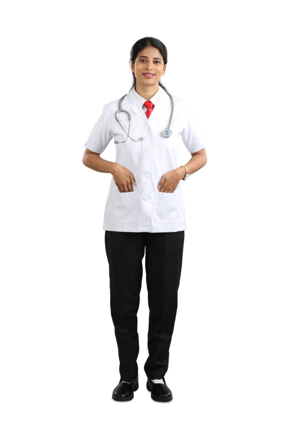 Male doctor adjusting his white coat buttons, smiling.