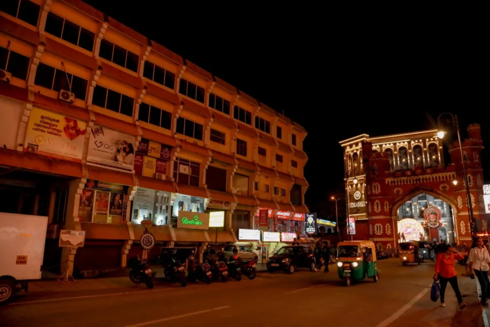 Reethatex uniform store front view decorated with lights at night in Trivandrum